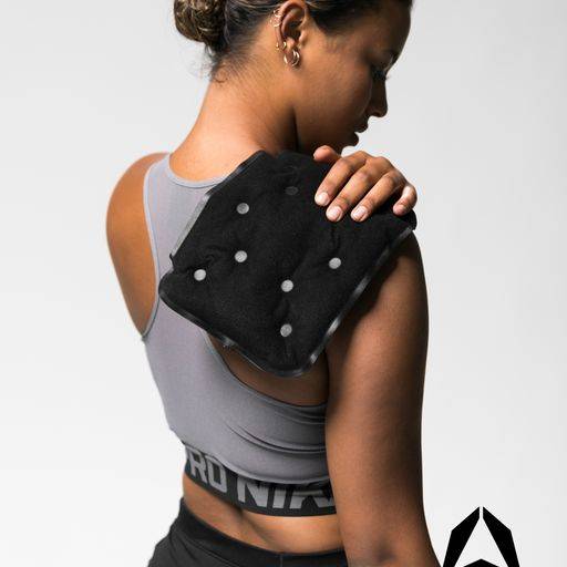 A girl using heat pads for back pain